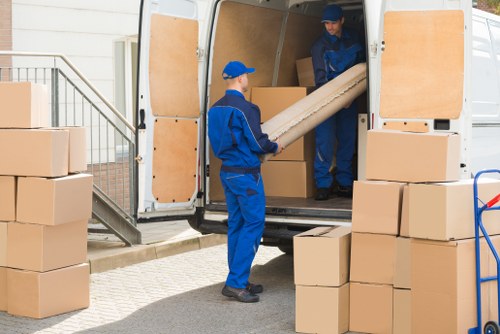 Removal van and packed boxes outside a Tooting home
