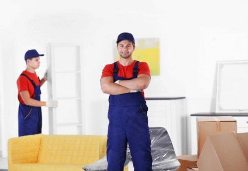 A professional moving team handling furniture in Tooting