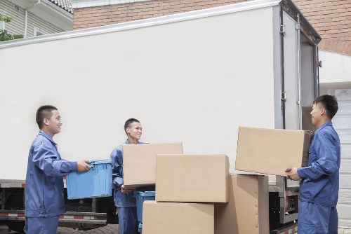 Removal team loading household items for transport