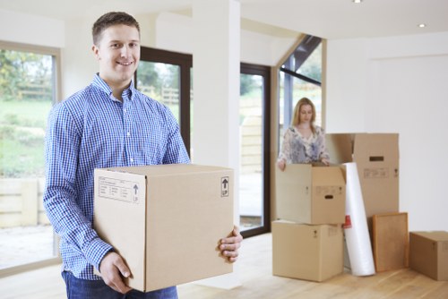 Professional movers handling furniture in a Tooting home