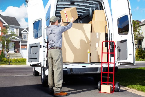 Professional movers loading a van in south west London