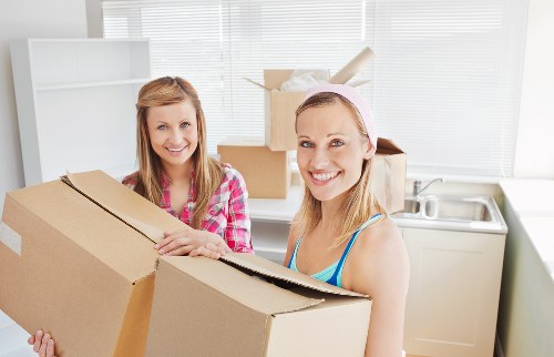 Loading furniture into a van for a Tooting home relocation